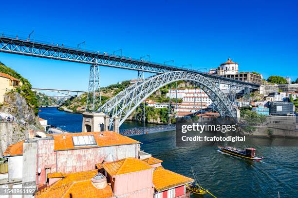 dom luís i bridge over douro river. harbor. portugal - distrito do porto portugal imagens e fotografias de stock