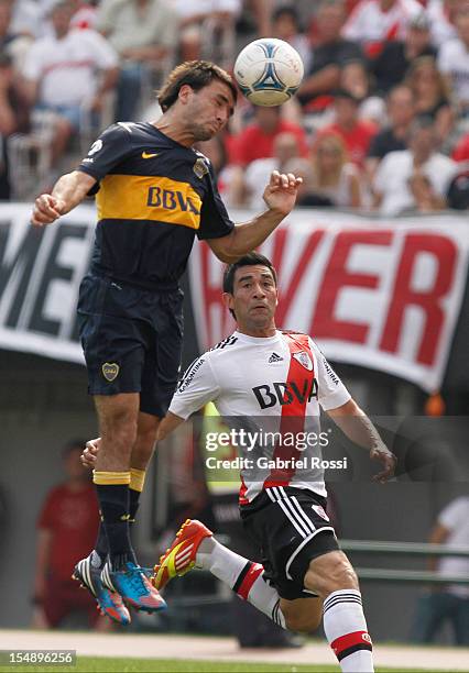 Sanchez of River Plate and Viatri of Boca Jr struggles for the ball during a match between Boca Juniors and River Plate as part of the Torneo Inicial...