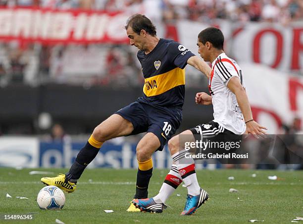 Somoza of Boca Jr fights for the ball during a match between Boca Juniors and River Plate as part of the Torneo Inicial 2012 at Antonio Vespucio...