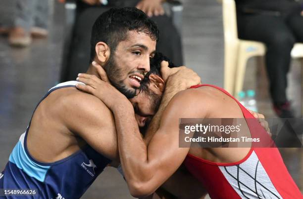 Sujeet Kalkal in action against Rohit Gulia in the men's 65kg category event during the Asian Games 2023 wrestling trials, at IGI stadium, on July...
