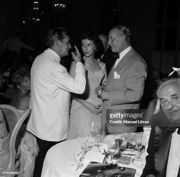 Marcel Pagnol, Betsy Blair and Maurice Chevalier at Gala little white beds at the Deauville casino.