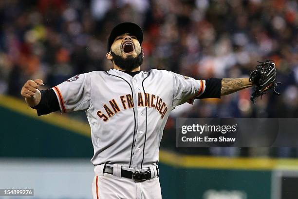 Sergio Romo of the San Francisco Giants celebrates striking out Miguel Cabrera of the Detroit Tigers to win Game Four of the Major League Baseball...