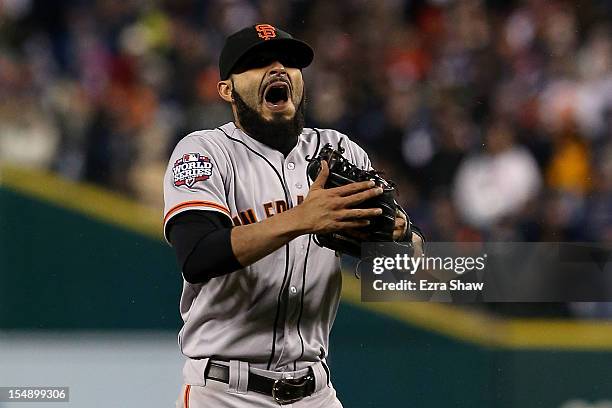 Sergio Romo of the San Francisco Giants celebrates striking out Miguel Cabrera of the Detroit Tigers in the tenth inning to win Game Four of the...