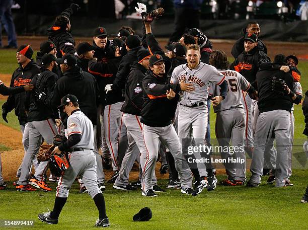 Hunter Pence of the San Francisco Giants celebrates with his teammates after they defeated the Detroit Tigers in the tenth inning to win Game Four of...