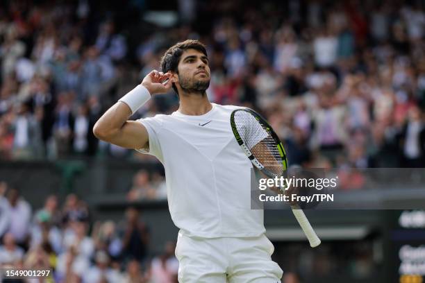 Carlos Alcaraz of Spain celebrates during his match against Novak Djokovic of Serbia in the final of the men's singles during day fourteen of The...