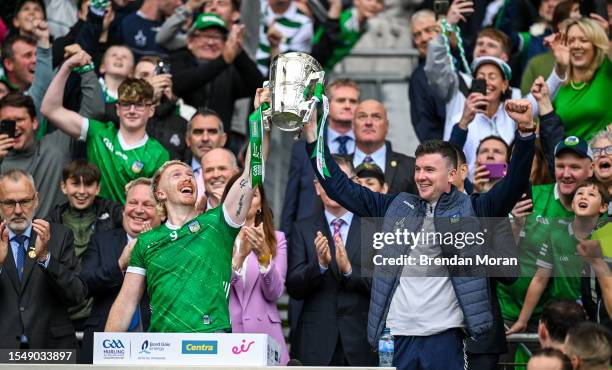 Dublin , Ireland - 23 July 2023; Limerick playing captain Cian Lynch, left, and injured team captain Declan Hannon celebrate as they lift the Liam...