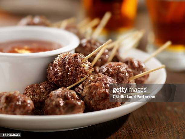 meatball appetizers with a couple of beers - meatball stock pictures, royalty-free photos & images