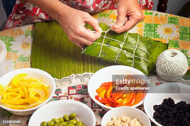 making hallacas - venezuelan christmas traditional food - south american culture stock pictures, royalty-free photos & images