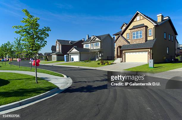 few suburban houses - new pavement stock pictures, royalty-free photos & images