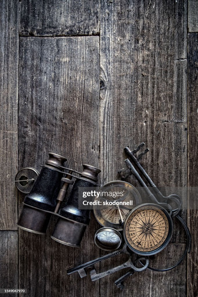 Antique Compasses on Old Wood