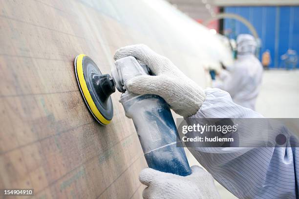 worker grinding - metal sanding stock pictures, royalty-free photos & images