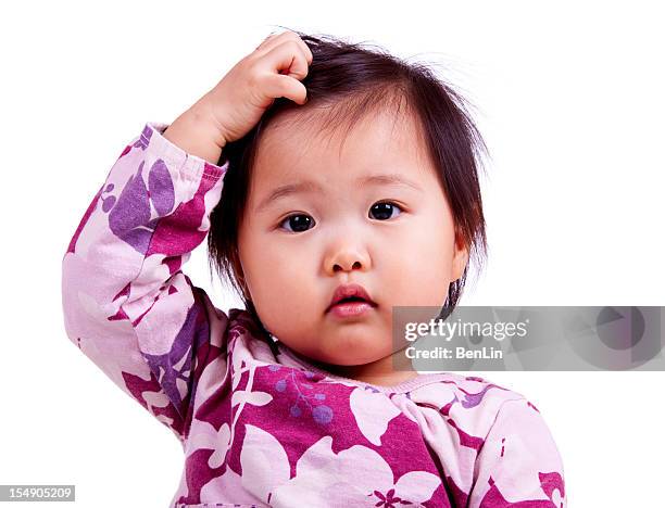confused asian baby isolated on white - zich op het hoofd krabben stockfoto's en -beelden