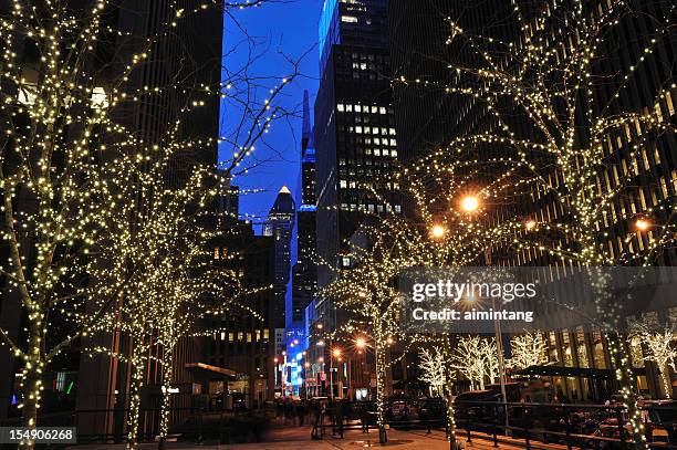 holiday lighting in manhattan of new york city - christmas newyork stock pictures, royalty-free photos & images