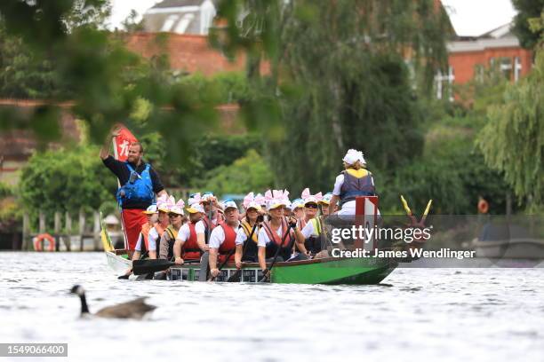 Dragon boat teams race during the Kingston Dragon Boat Challenge on July 16, 2023 in Kingston upon Thames, England. Organised by the Kingston Rotary...