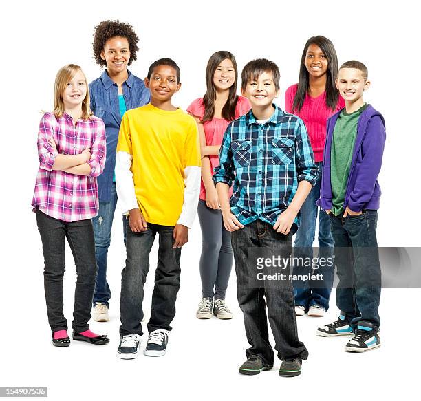 diverse group of children standing together - isolated - pre adolescent child stock pictures, royalty-free photos & images