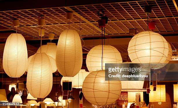 atmospheric luminous paper lamps - japanese lantern stock pictures, royalty-free photos & images