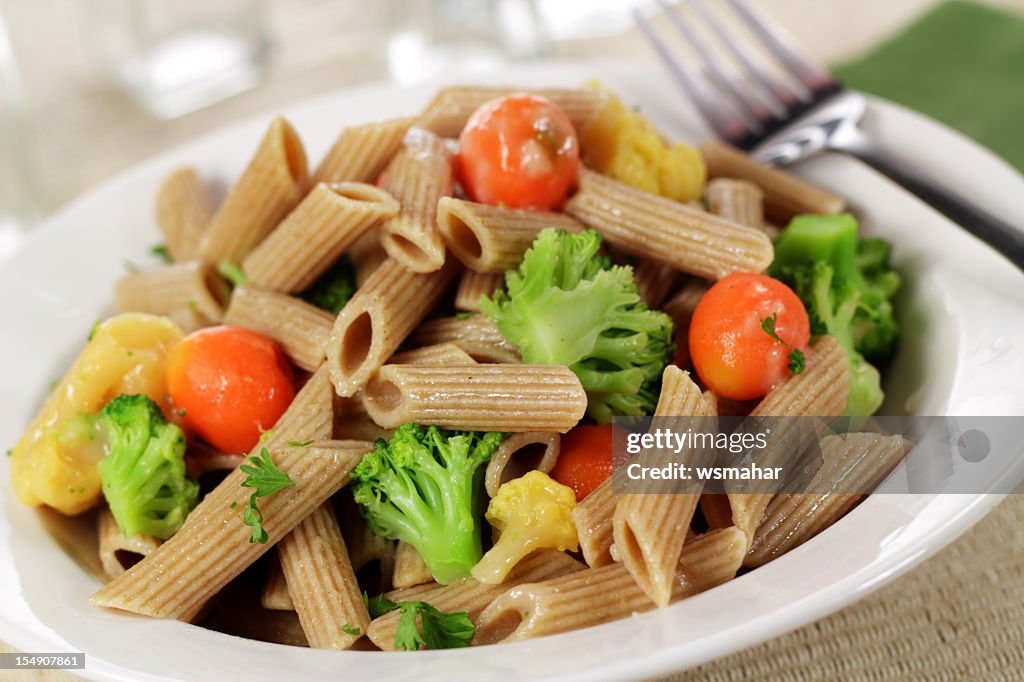 Lunch consisting of whole wheat pasta and vegetables