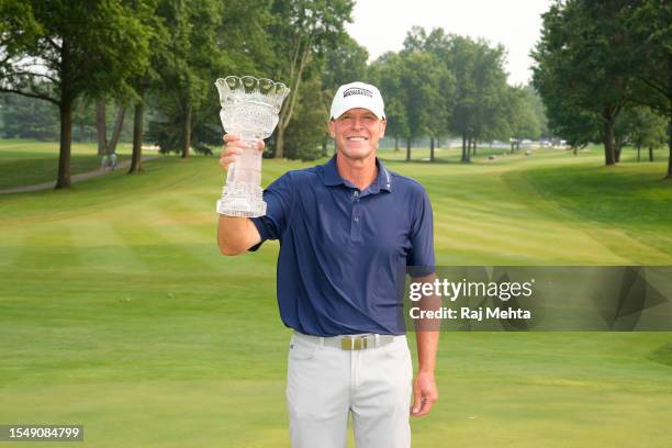 Steve Stricker of the United States poses with the trophy after winning the Kaulig Companies Championship at Firestone Country Club on July 16, 2023...
