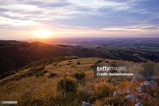 landscape shot of port hills and canterbury plains - canterbury plains stock pictures, royalty-free photos & images