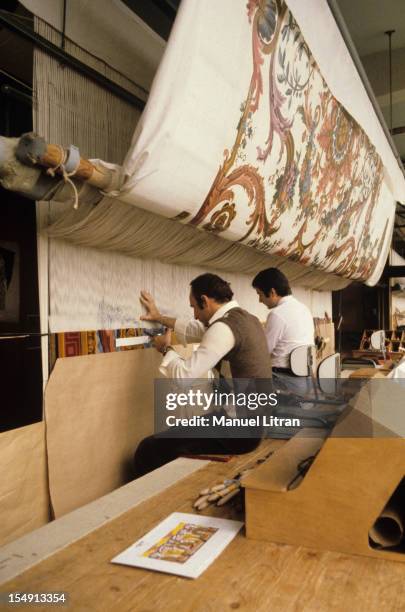 France, in October 1981, Restoration of the king's bedchamber in Versailles: upholsterers working on a trade .