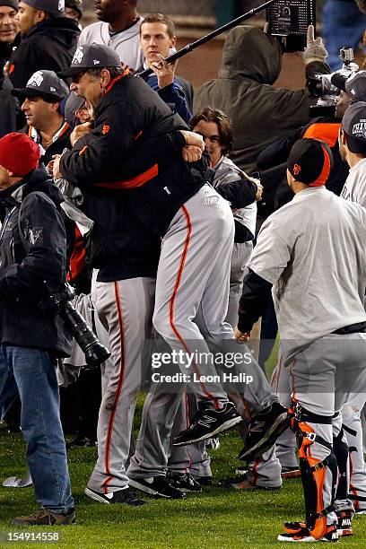 Manager Bruce Bochy of the San Francisco Giants celebrates after defeating the Detroit Tigers to win Game Four of the Major League Baseball World...