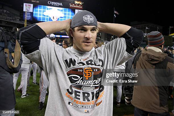 Ryan Theriot of the San Francisco Giants celebrates after defeating the Detroit Tigers to win Game Four of the Major League Baseball World Series at...