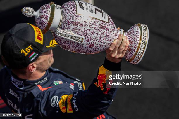 1st Max Verstappen of Netherland and Oracle Red Bull Racing driver with the trophy on the podium at Formula 1 Qatar Airways Hungarian Grand Prix on...