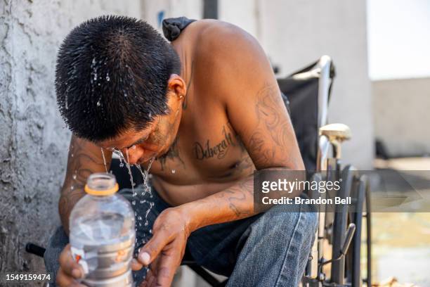 Dee Lee cools off amid searing heat that was forecast to reach 115 degrees Fahrenheit on July 16, 2023 in Phoenix, Arizona. A heat dome over Texas...