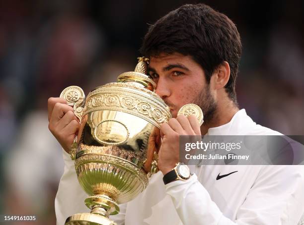 Carlos Alcaraz of Spain with the Men's Singles Trophy following his victory in the Men's Singles Final against Novak Djokovic of Serbia on day...