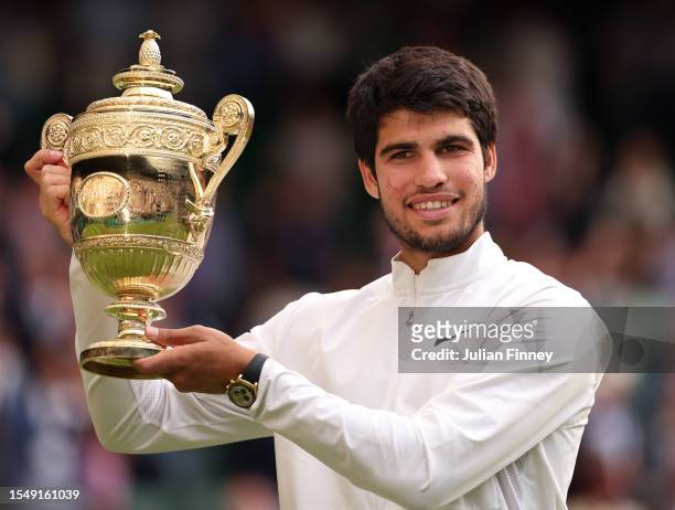 Carlos Alcaraz of Spain with the Men's Singles Trophy following his victory in the Men's Singles Final against Novak Djokovic of Serbia on day...