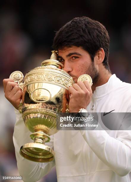 Carlos Alcaraz of Spain with the Men's Singles Trophy following his victory in the Men's Singles Final against Novak Djokovic of Serbia on day...