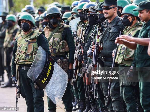 Sri Lanka Army stand guard as Members of the Socialist Youth Union Protest in Colombo on July 23, 2023. They remembrance of a number of events in the...