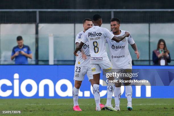Marcos Leonardo of Santos celebrates with teammates after scoring the team's first goal during the match between Santos and Botafogo as part of...