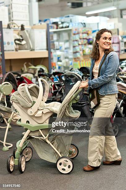 shopping for a new stroller - baby products stock pictures, royalty-free photos & images