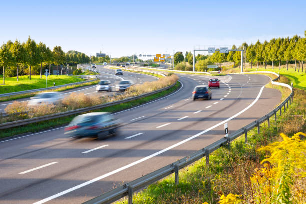 motion blur of traffic on multilane highway - highway stock pictures, royalty-free photos & images