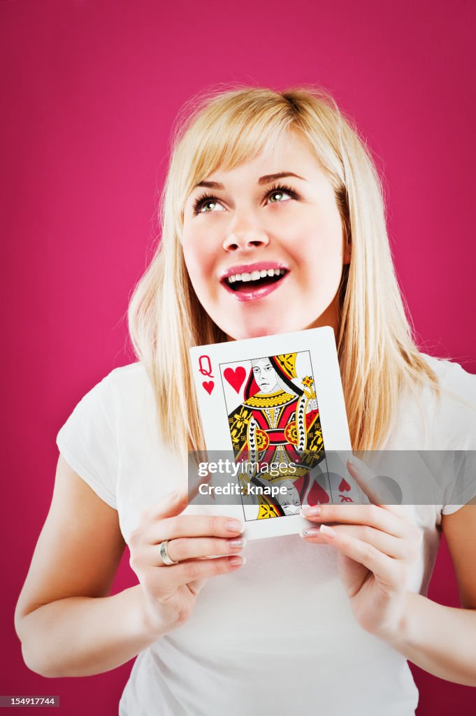 Woman holding queen of hearts