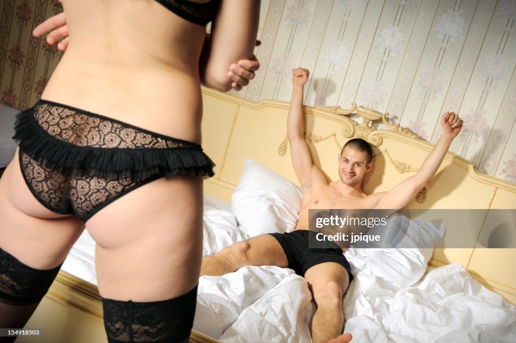 Victorious man lying and woman's back