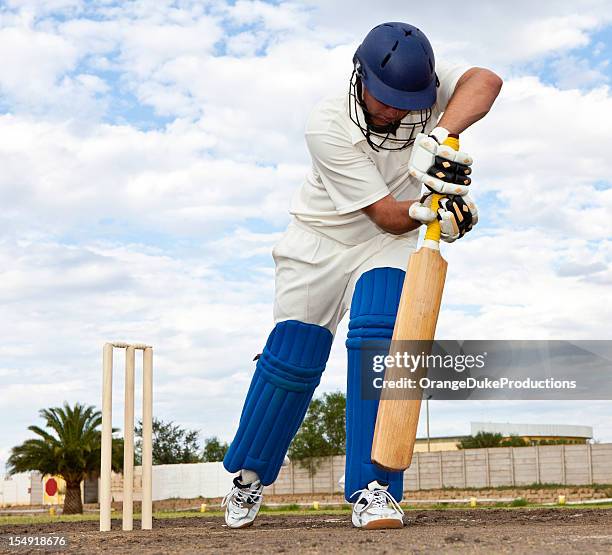 close-up of cricket player getting ready to strike - cricket bat helmet stock pictures, royalty-free photos & images