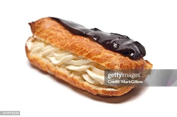 tasty chocolate eclair isolated on a white background - eclair stockfoto's en -beelden