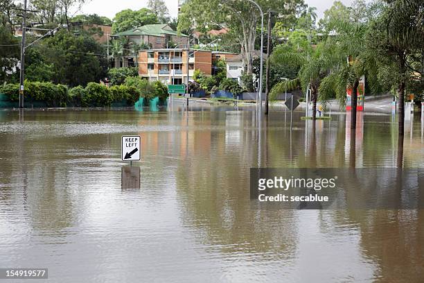 road covered by flood - queensland stock pictures, royalty-free photos & images