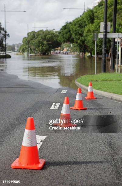 road cones and flood - brisbane sign stock pictures, royalty-free photos & images