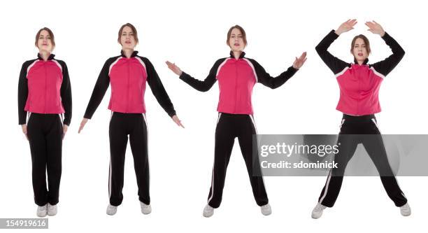 woman demonstrating jumping jacks - jumping jack stock pictures, royalty-free photos & images