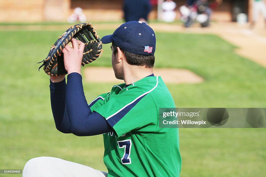 Baseball Pitcher Left Handed Youth Warming Up on Sideline