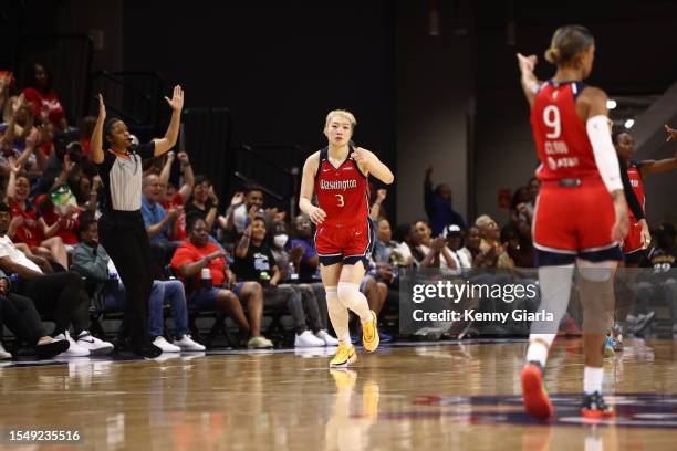 Li Meng of the Washington Mystics celebrates a three point basket during the game against the Phoenix Mercury on July 23, 2023 at Entertainment and...