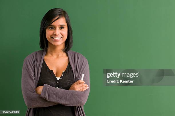 smiling student at blackboard - portrait of teacher and student bildbanksfoton och bilder