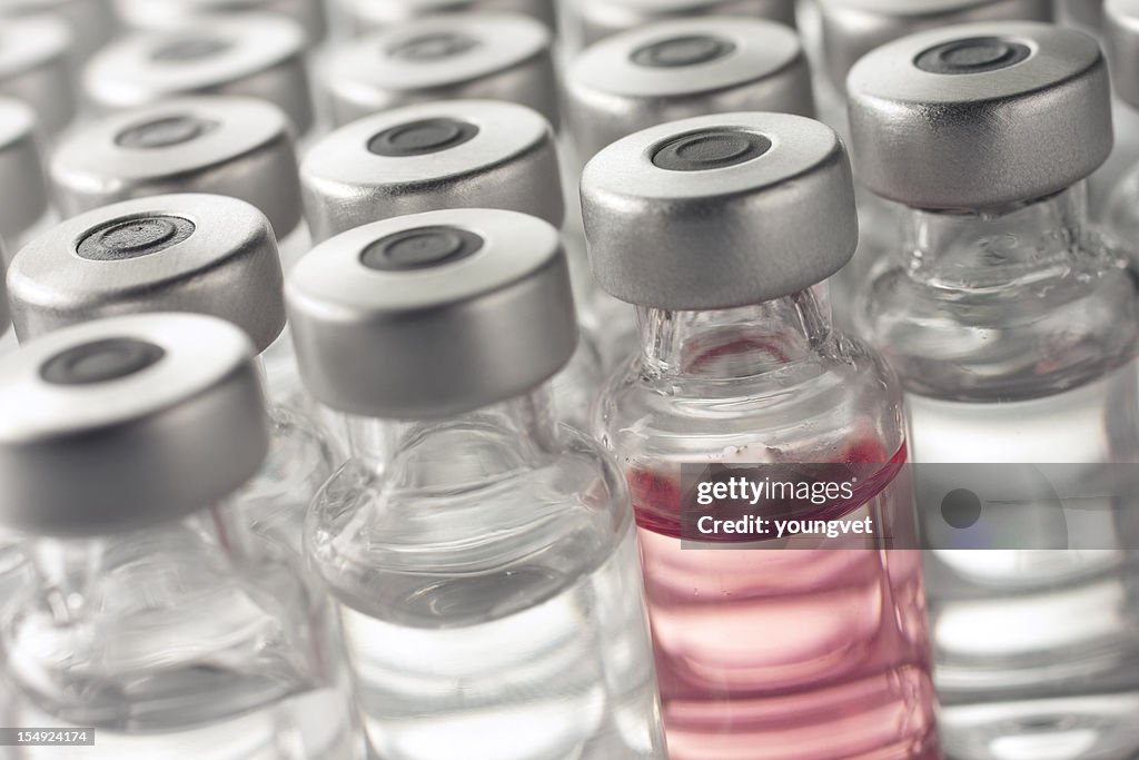 Vial of pink medicine or vaccine