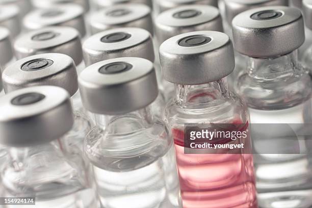 vial of pink medicine or vaccine - chemotherapy stock pictures, royalty-free photos & images