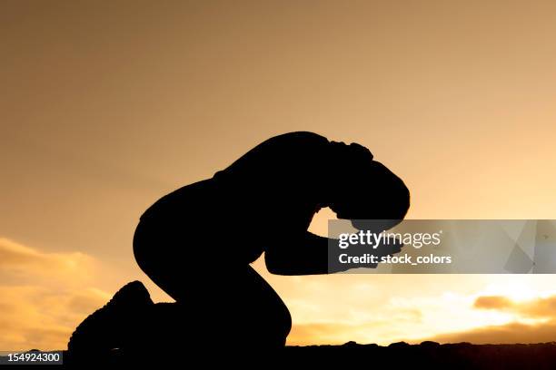 praying - un certain regard stock pictures, royalty-free photos & images