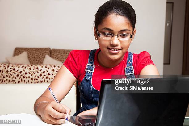 indian teenager and laptop - 12 year old indian girl stock pictures, royalty-free photos & images