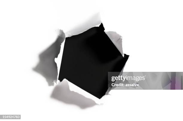 black hole in torn white paper - the hole stockfoto's en -beelden